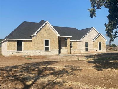 View of front of house with a patio area