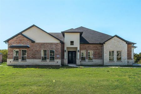 Rear view of house featuring a yard