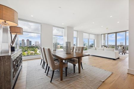 This angle captures the floor-to-ceiling full wall of windows which defines the unit.  All window shades are controlled remotely.