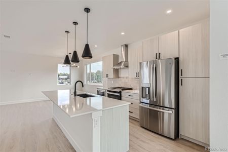 Open floorplan, great for relaxing or entertaining. Brightened by natural light from large windows. Kitchen includes all appliances and island seating.