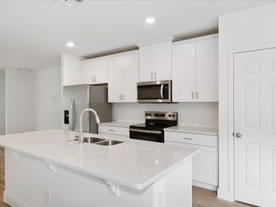 Kitchen in the Everglade floorplan at 232 Links Terrace Blvd