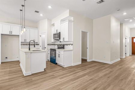 Looking toward the kitchen and office from the living room.