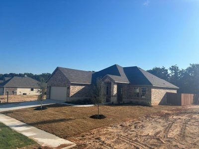 View of front facade featuring a garage