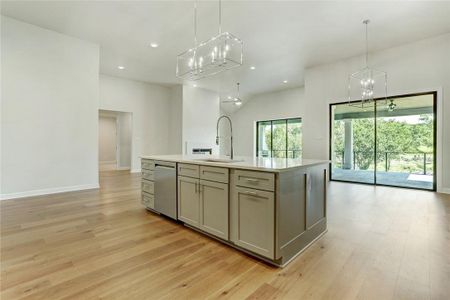 The kitchen overlooks the dining room and the family room in this marvelous plan.