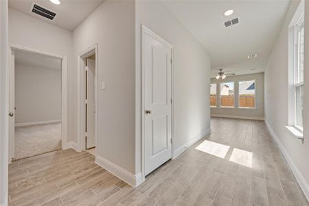 Corridor featuring light wood-type flooring