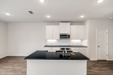 New construction Single-Family house 7208-A Grenadine Bloom Bend, Del Valle, TX 78617 Townhome Series - Acadia E- photo 5 5