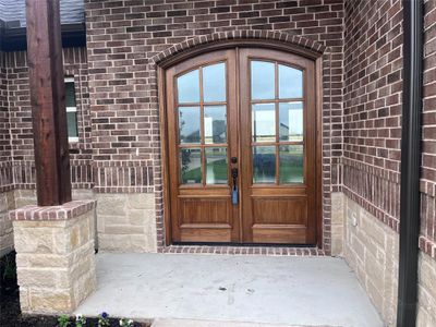 Doorway to property featuring french doors