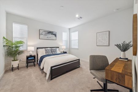 This spacious first-floor bedroom offers ample natural light through multiple windows, creating a bright and welcoming atmosphere. The neutral carpeting and clean design provide a versatile space suitable for a guest room, home office, or personal retreat. With a functional layout, this room offers comfort and flexibility for a variety of uses.