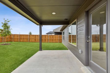 Covered Patio in the Jade home plan by Trophy Signature Homes – REPRESENTATIVE PHOTO