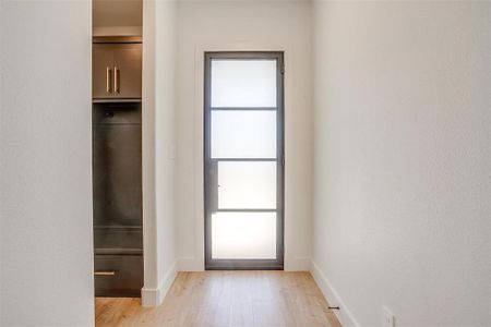 Doorway to outside featuring light hardwood / wood-style floors