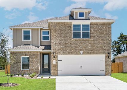 The two-story Driftwood plan has a gorgeous brick exterior with siding detail.