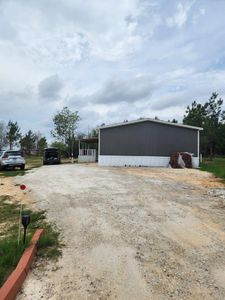 New construction Single-Family house 209 County Road 5805, Cleveland, TX 77327 - photo 2 2