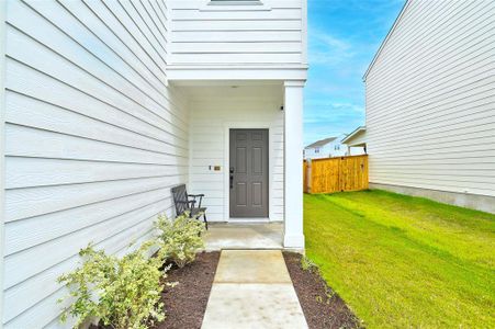 Cute front porch and walk way.  Sprinkler system makes it easy to maintain the landscaping.