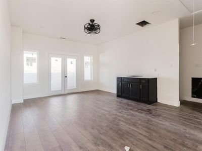 Unfurnished living room with hardwood / wood-style floors