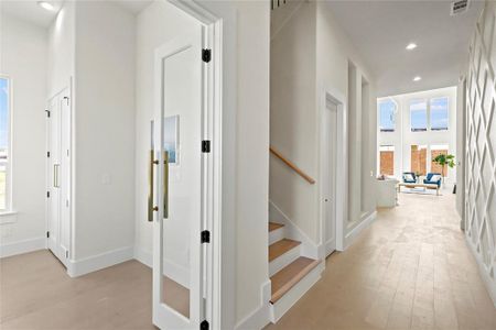 Hall featuring light wood-type flooring