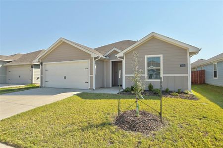 Single story home with a front lawn and a garage