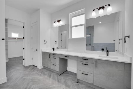 Bathroom with double vanity and parquet floors