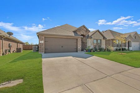 View of front of property with central air condition unit, a front yard, and a garage