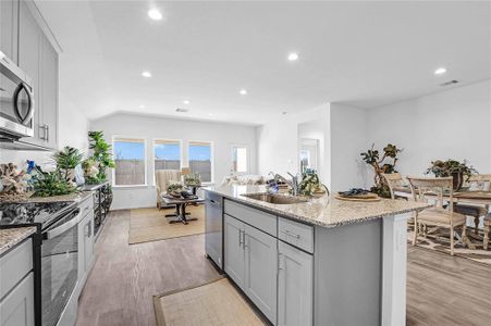 The Gourmet Kitchen flows into the Casual Dining Area and the Huge Family Room! Wonderful Open Concept! **Image Representative of Plan Only and May Vary as Built**