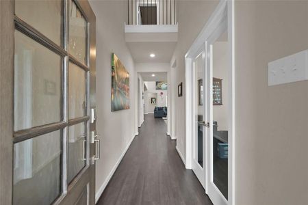 Your elegant front door provides a warm welcome into the foyer of your home.  Notice the neutral paint color and luxury vinyl plank flooring running throughout the first floor of the home.