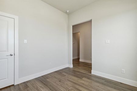 Unfurnished room featuring hardwood / wood-style flooring