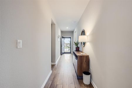 The entry way is light and bright with a front door you can leave open to a full glass door to take in tons of natural light and enjoy your quiet neighborhood.