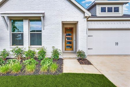 Doorway to property featuring a garage