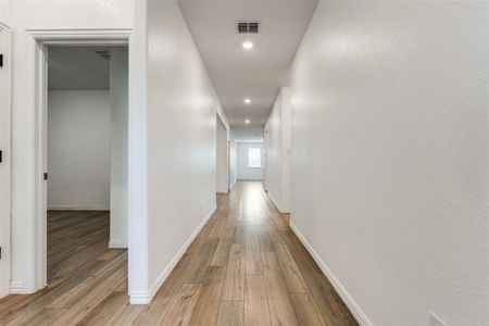 Hallway with light wood-type flooring