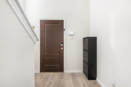 Doorway to outside featuring light hardwood / wood-style floors