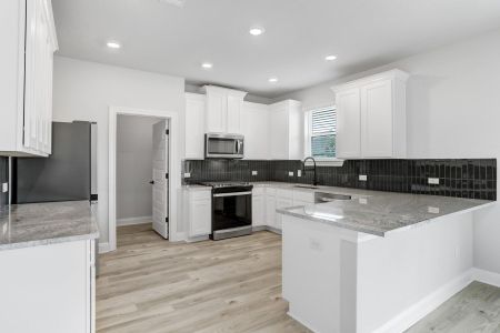 Lots of counter space in this spacious kitchen, including a large walk-in pantry