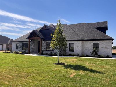 View of front of house with a front lawn