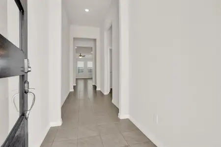 Corridor with light tile floors
