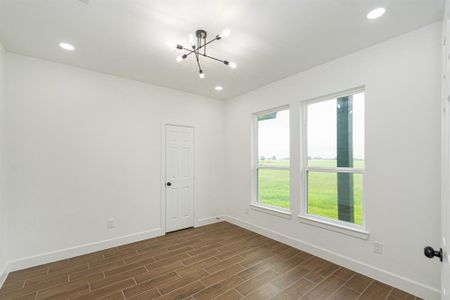 Office/Study/Dining or 4th Bedroom with closet.  Tiled flooring, recessed lights, and modern light fixture.  Two oversized windows for ample natural light.