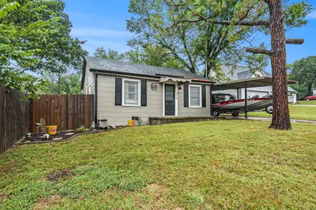 Wood fence surrounds the backyard of this home.