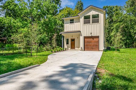 New construction Single-Family house 1005 Spokane River Road, Conroe, TX 77316 - photo 0