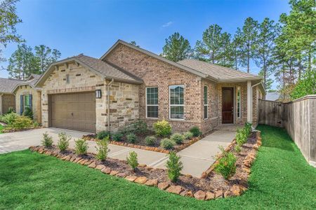 Neatly manicured landscaping adorns a welcoming front entry!