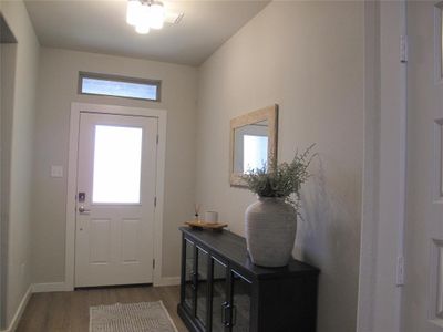 Entryway with a healthy amount of sunlight and hardwood / wood-style floors