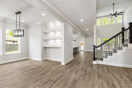 Enjoy impeccably designed interior with an open floor plan, elevated ceilings, refined details, wood-look tile floors, and chic modern color palette.