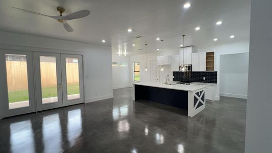 living room with open concept to kitchen