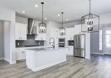 Fully-equipped kitchen with top-tier appliances and an oversized island.