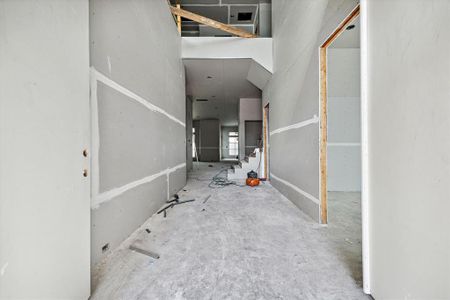 Entry with dramatic 26 foot foyer ceiling.  12 foot ceiling throughout the first floor.  Study is to the right of this picture.  Construction as of 10/29