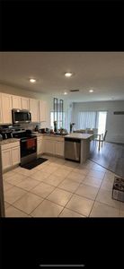 New construction Single-Family house 332 Boardwalk Avenue, Haines City, FL 33844 - photo 1 1
