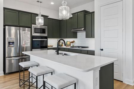 Kitchen w/ Quartz Countertops and Tile Backsplash