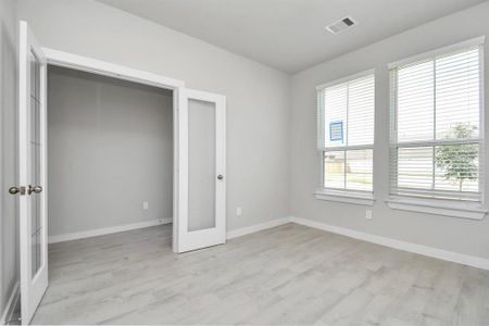 Another view of study with French doors. Sample photo of completed home with similar floor plan. Actual colors and selections may vary.