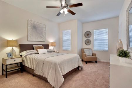 The primary bedroom has vinyl plank flooring and its own primary bathroom with walk-in closets.