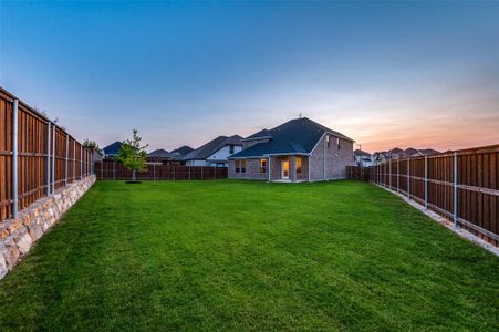 View of yard at dusk