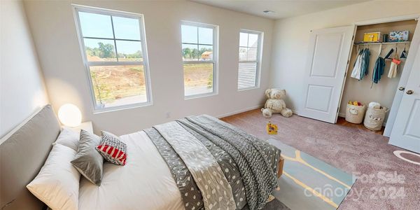 Secondary bedroom shown with virtual staging