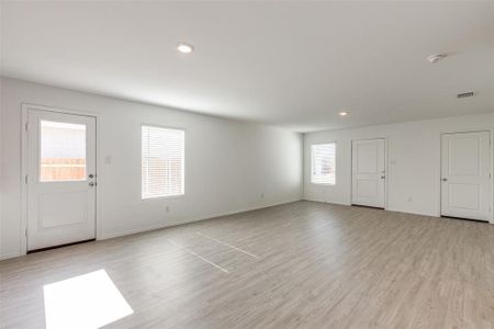 Foyer with plenty of natural light and light hardwood / wood-style floors