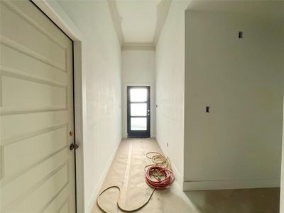 Corridor featuring crown molding