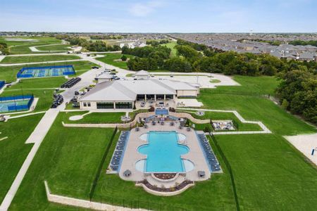 View of swimming pool featuring a patio area and a yard